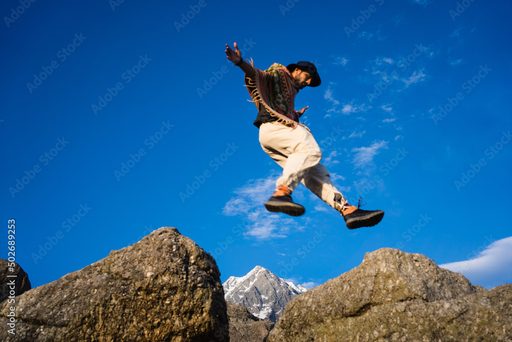 Running Man on Mountains jumping cliff over Mountain Skyrunning sport Lifestyle Travel concept outdoor, Triund Top Himachal Pradesh, India Running Man on Mountains jumping cliff over Mountain Skyrunning sport Lifestyle Travel concept outdoor, Triund Top Himachal Pradesh, India