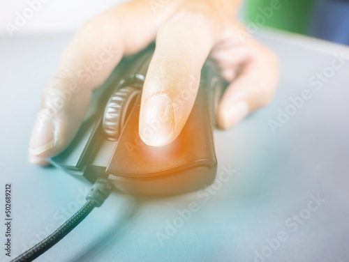 hand grip mouse black with usb cable Work or shop online Use your finger to press the switch, the left has light and the right is on a gray workspace, leaving the copy space.