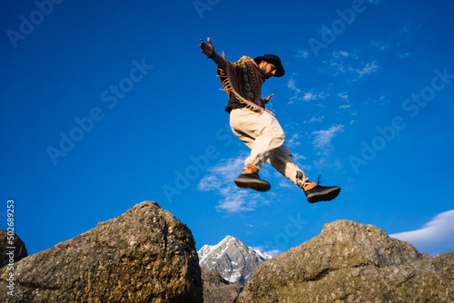 Running Man on Mountains jumping cliff over Mountain Skyrunning sport Lifestyle Travel concept outdoor, Triund Top Himachal Pradesh, India