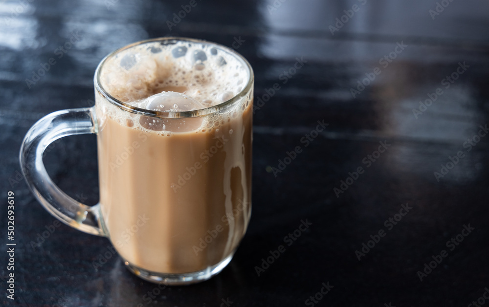 Teh Tarik, is infused black tea with milk served in thick froth. Popular drinks in Malaysia Teh Tarik, is infused black tea with milk served in thick froth. Popular drinks in Malaysia