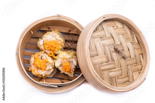 Freshly steamed siew mai or shaomai is poular Cantonese Chinese dim sum delicacy photo