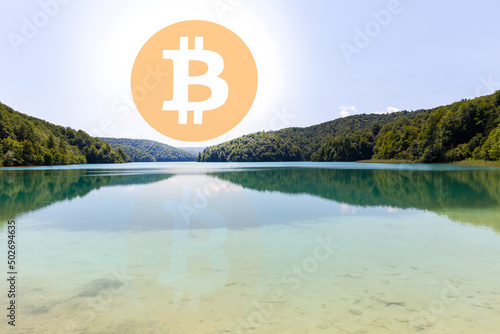Bitcoin symbol on the lake © Martin Matyas