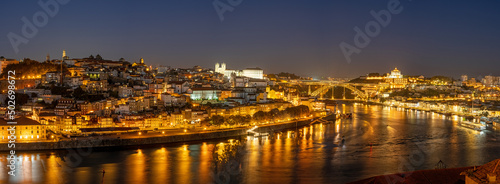 Panorama of Porto with the Douro river at night © elxeneize