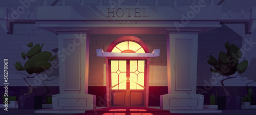 Luxury hotel building facade at night. Expensive hotel entrance on dark city street. Vector cartoon illustration of guest apartments exterior with double doors, marble columns and five gold stars
