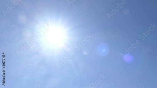 Blue Sky And Sun With Lens Flare
