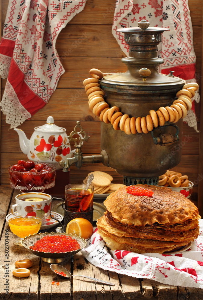 Pancakes with red caviar and samovar tea