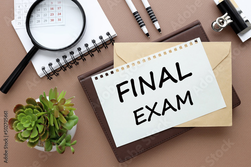 Tablou pe pânză Final Exam. text on paper on an envelope and diary on the desk