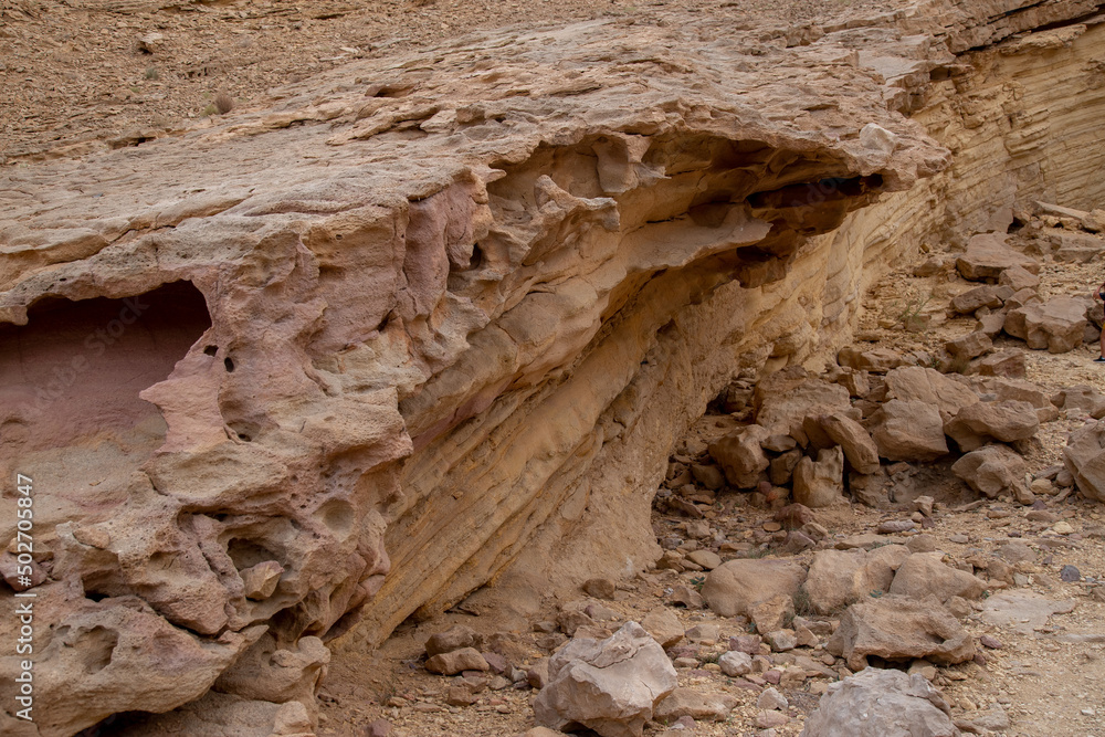 rock formation with sand and lava rock in desert with grain and out of focus up close rock formation with sand and lava rock in desert with grain and out of focus up close