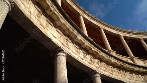 Slow panning motion over roman architecture pillars with blue sky photo