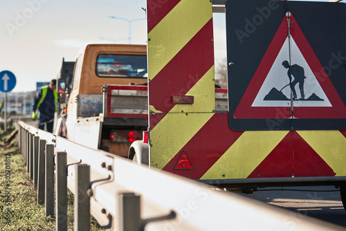 Public road work and closure sign.