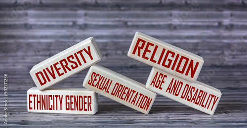 Diversity ethnicity gender age sexual orientation religion disability words written on wooden block. Equality and diversity concept.