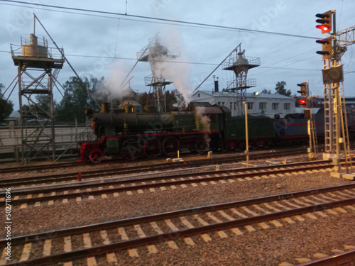 steam locomotive on rails at dry morning © Valeriy
