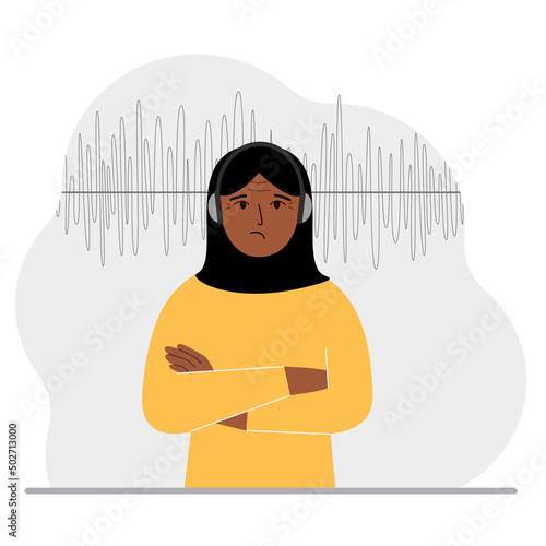 Muslim woman in headphones and a sound track. Concept of online podcast, radio, online books, online learning and music.