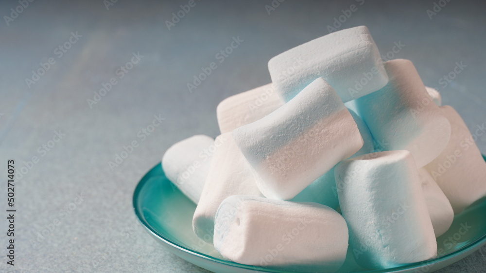 Pink ,white and blue marshmallows on a plate Pink ,white and blue marshmallows on a plate