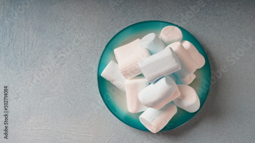 Pink ,white and blue marshmallows on a plate