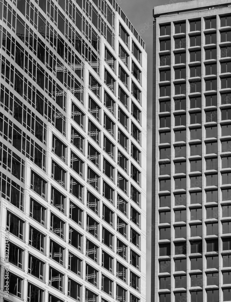 Architecture exterior facade view of modern building wall with lights and shadows. Modern architecture in a square shape Architecture exterior facade view of modern building wall with lights and shadows. Modern architecture in a square shape