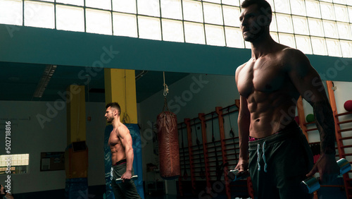 posing bodybuilder in the gym