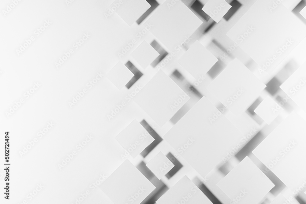 Grey geometric texture with flying rhombuses in hard light with contrast gradient dark shadows as border, copy space, top view. Simple abstract background in minimal style. Grey geometric texture with flying rhombuses in hard light with contrast gradient dark shadows as border, copy space, top view. Simple abstract background in minimal style.