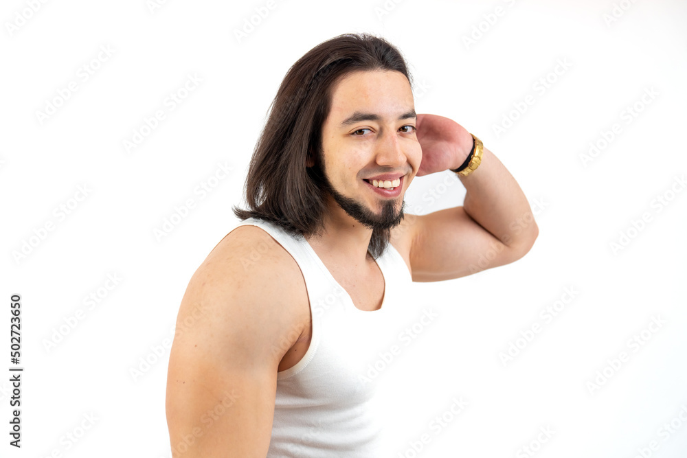 European smiling hipster leans on the wall white background isolated copy space studio shot . High quality photo European smiling hipster leans on the wall white background isolated copy space studio shot . High quality photo