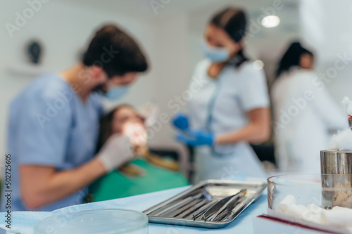 Focus on a dental tool in the medical tray in a dental clinic