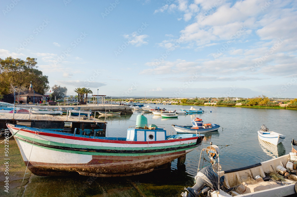 Fishing boats at the mooring in front of Fuseta in the Algarve