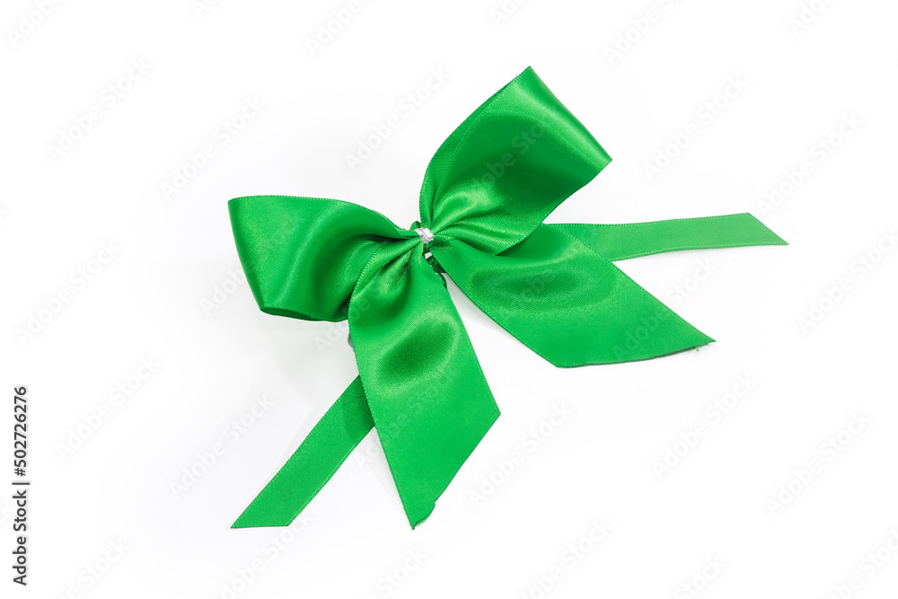 Top view of green satin bow-knot on white background Top view of green satin bow-knot on white background