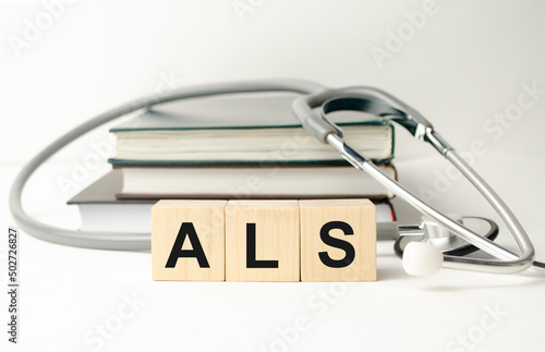 the acronym als for Amyotrophic Lateral Sclerosis concept represented by wooden letter photo