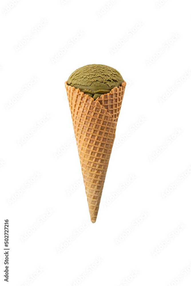 Green ice cream in a waffle cone isolated on white. Green ice cream in a waffle cone isolated on white.