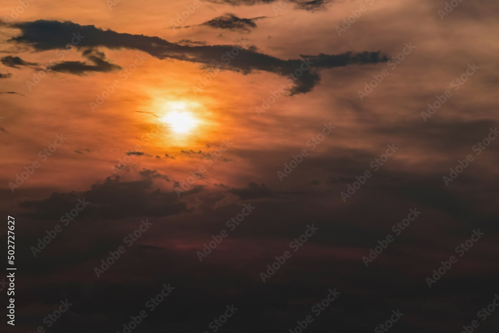 A beautiful dramatic sunset in a cloudy twilight sky. A beautiful dramatic sunset in a cloudy twilight sky.