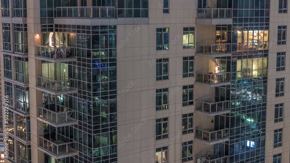 Windows in high-rise building exterior in the late evening with interior lights on timelapse Windows in high-rise building exterior in the late evening with interior lights on timelapse