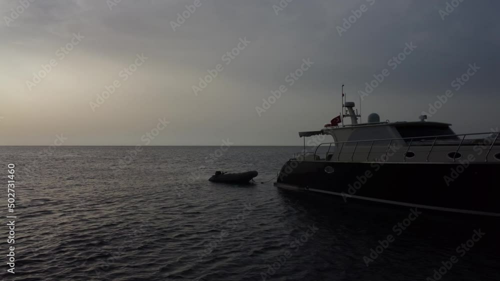 Boat tied to a yacht. High quality 4k footage Boat tied to a yacht. High quality 4k footage