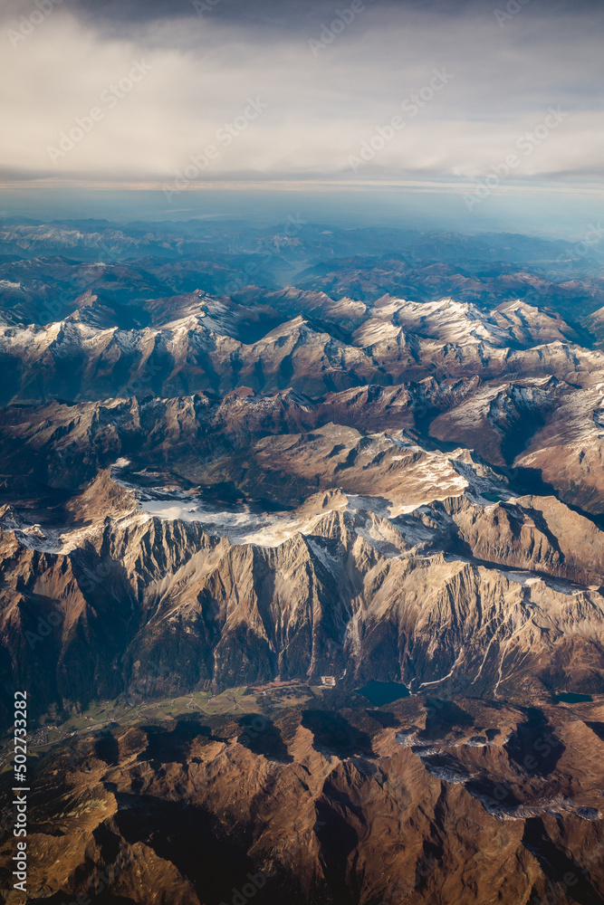View from the plane on the alps, covered in the first snow. View from the plane on the alps, covered in the first snow.