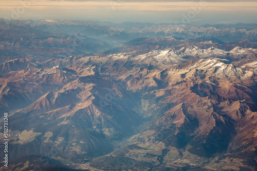 View from the plane on the alps, covered in the first snow.
