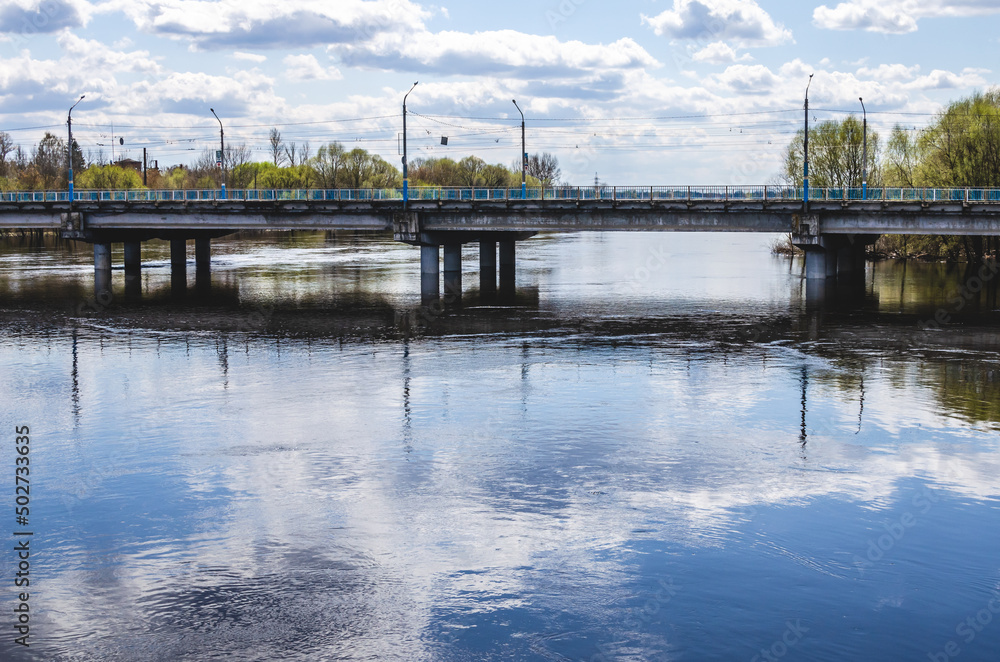 Automobile bridge across the river in russia in spring