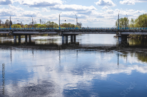 Automobile bridge across the river in russia in spring