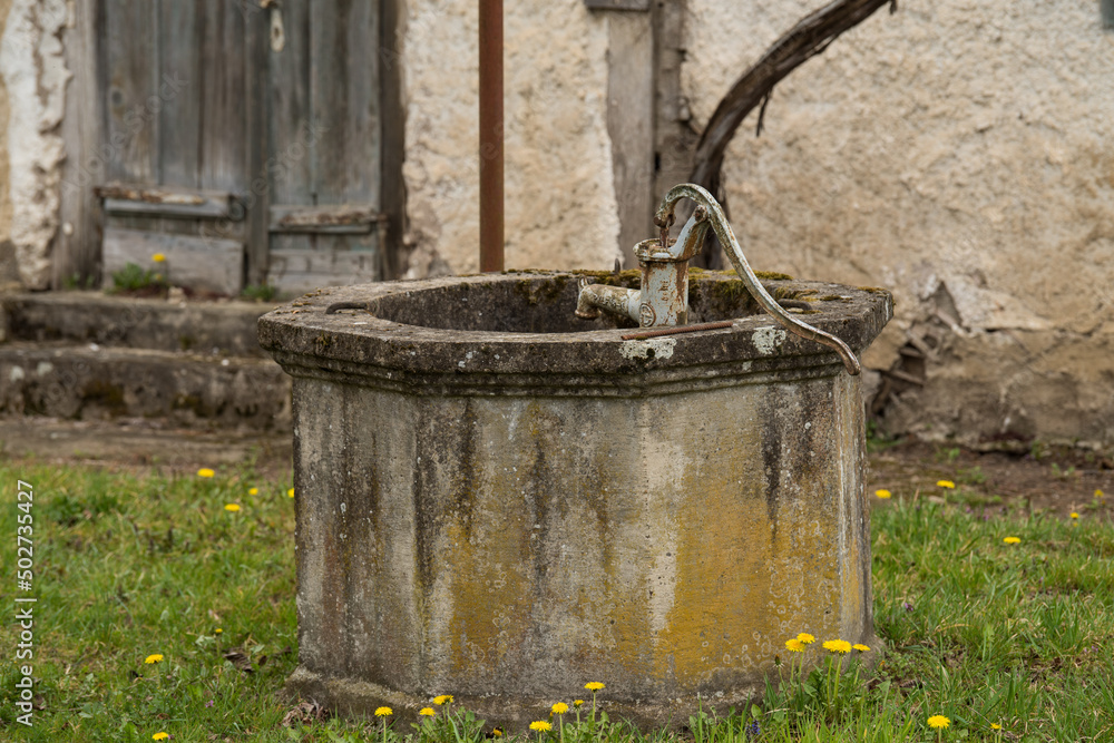 Croatia, May 01,2022: Well for drawing water located in the countryside. Croatia, May 01,2022: Well for drawing water located in the countryside.