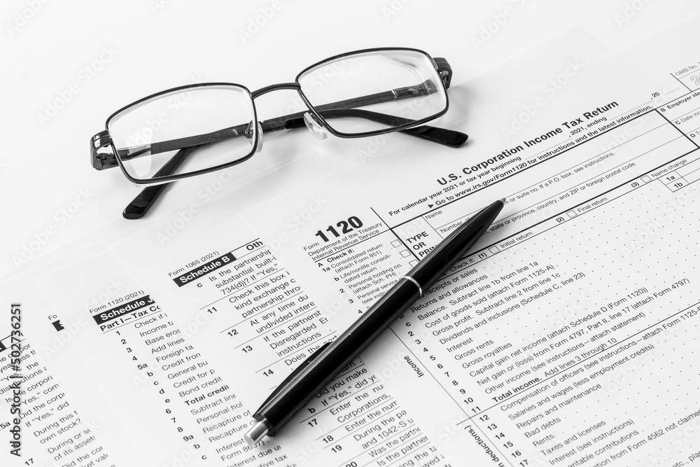 Pen on US individual tax form. Tax payment season Pen on US individual tax form. Tax payment season