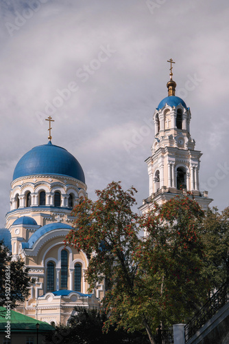 Uspensky cathedral and bell tower of Uspenskaya Tikhonova Pustyn on sunny summer day. Leo Tolstoy village, Kaluga Oblast, Russia. photo