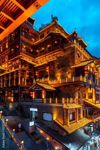 Close-up of night view of Hongya Cave in Chongqing photo