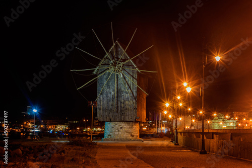 Old wooden windmill in the old town of Nessebar, Bulgaria at night