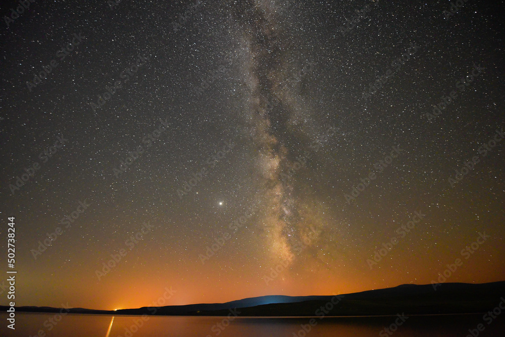 A breathtaking view of the Milky Way at night in Arpi lake, Armenia