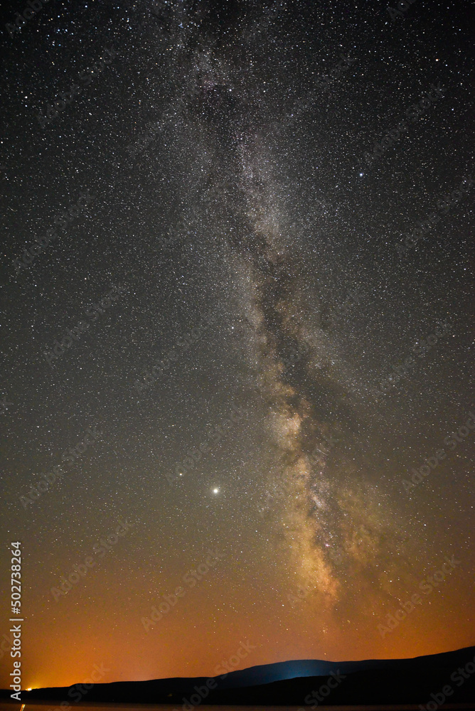 A breathtaking view of the Milky Way at night in Arpi lake, Armenia