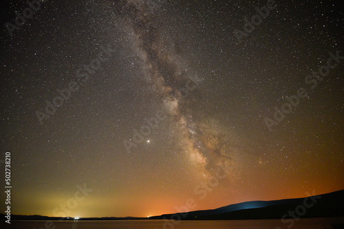 A breathtaking view of the Milky Way at night in Arpi lake, Armenia