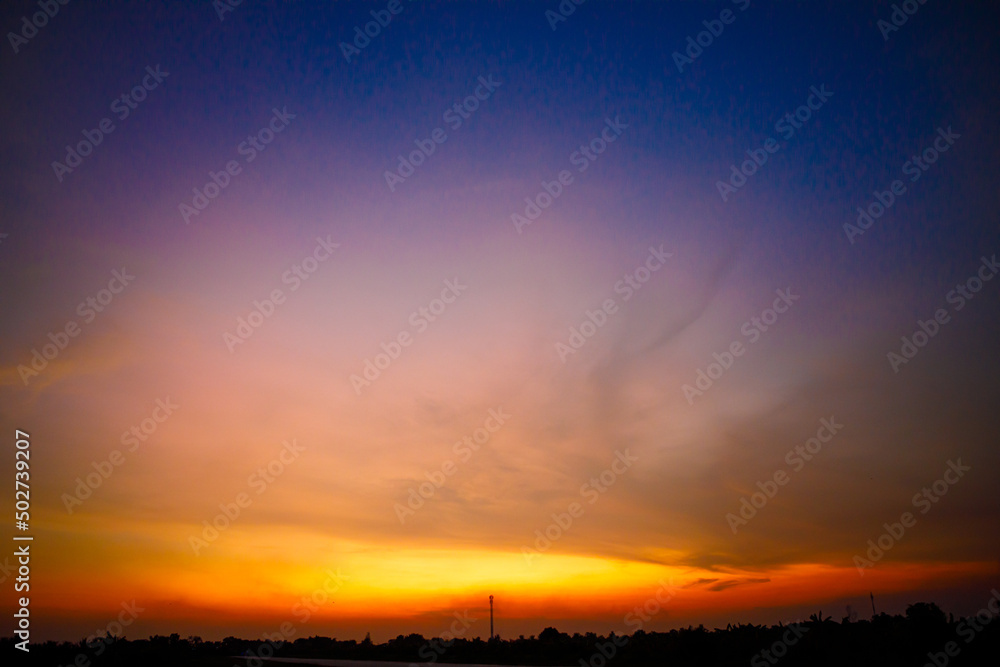 Evening sky with beautiful orange light after sunset