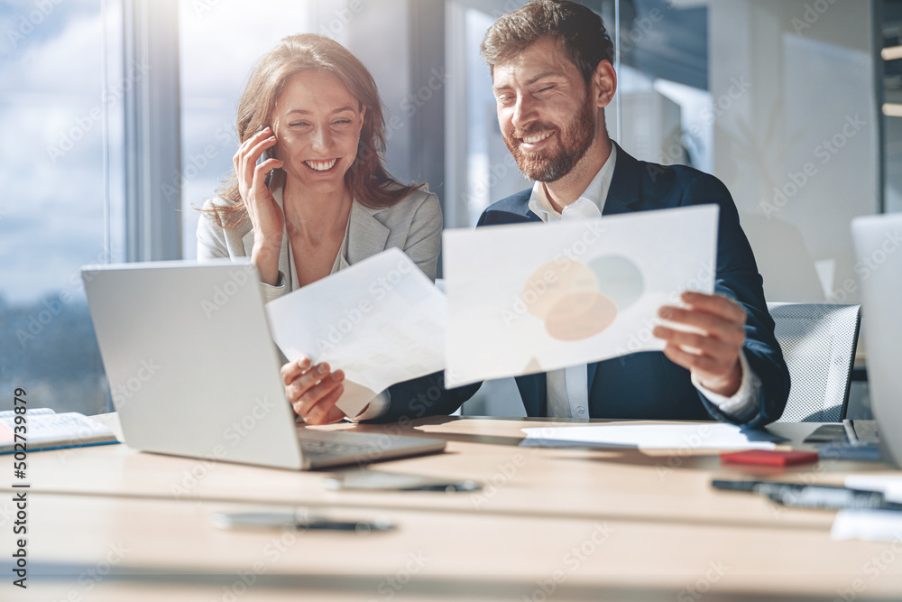 businessmen talk phone during meeting and discussing their business looking at financial charts businessmen talk phone during meeting and discussing their business looking at financial charts