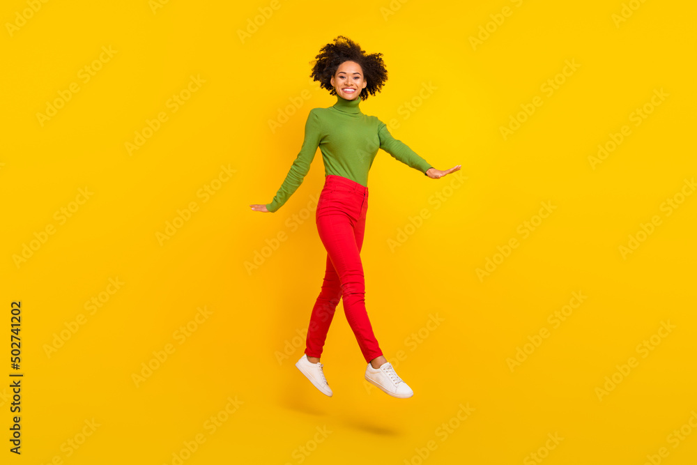 Full body profile side photo of young cheerful girl jump dream travel isolated over yellow color background