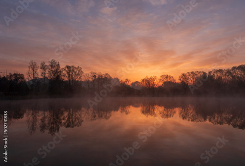 Fototapeta Naklejka Na Ścianę i Meble -  Misty sunrise over the ponds