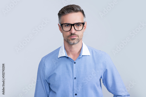 serious mature lawyer wearing glasses and office shirt