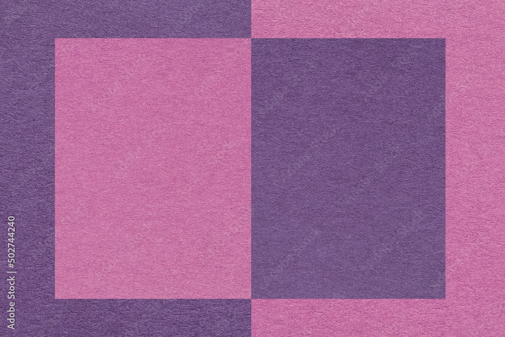 Fototapeta premium Texture of craft dark purple and lilac paper background, half two colors, macro. Structure of violet craft cardboard.