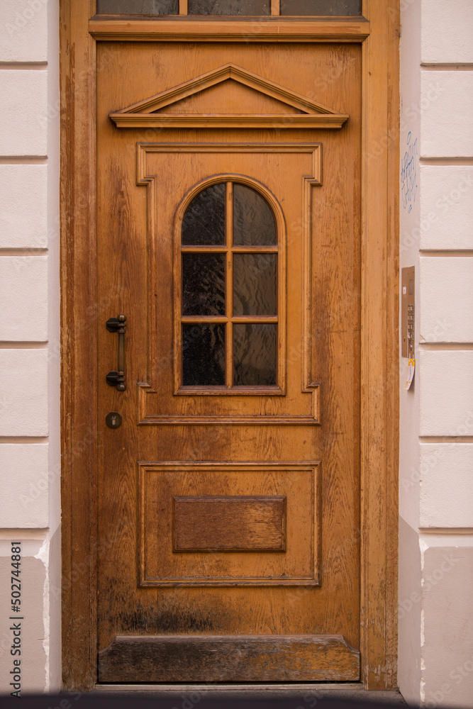 Munich, Germany - May 01, 2022: Old Decorative Main Entrance Wooden Door.